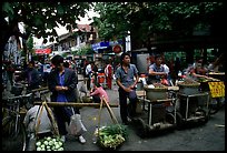 Street food vendors in an old alley. Kunming, Yunnan, China