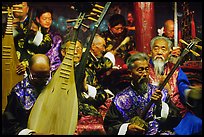 Elderly musicians of the Naxi Orchestra playing traditional instruments. Lijiang, Yunnan, China ( color)