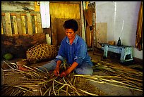 Woman weaving a toga (mat) out of pandamus leaves. American Samoa ( color)