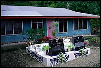 Tombs in front of a home in Faleasao. American Samoa ( color)