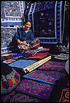Young woman sells crafts on market. Luang Prabang, Laos