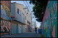 Man walking in alley, Mission District. San Francisco, California, USA ( color)
