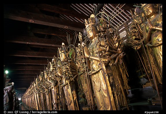 Rows of statues of the thousand-armed Kannon (buddhist goddess of mercy), Sanjusangen-do Temple. Kyoto, Japan (color)
