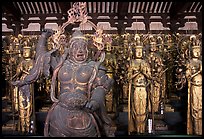 Some of the 1001 statues of the thousand-armed Kannon (buddhist goddess of mercy), Sanjusangen-do Temple. Kyoto, Japan (color)