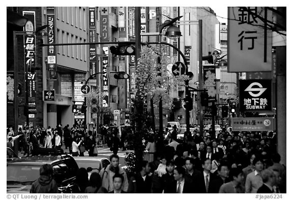 Street in Shinjuku 3-chome looking towards Yotsuya in front of Kinokuniya. Tokyo, Japan