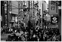 Street in Shinjuku 3-chome looking towards Yotsuya in front of Kinokuniya. Tokyo, Japan (black and white)