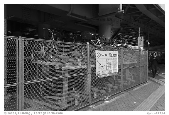 Stacked bicycle parking on the street. Tokyo, Japan (black and white)