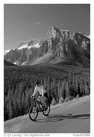 Cyclist on the road to the Valley of Ten Peaks. Banff National Park, Canadian Rockies, Alberta, Canada (black and white)