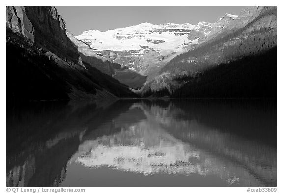 Victoria peak reflected in Lake Louise, early morning. Banff National Park, Canadian Rockies, Alberta, Canada (black and white)