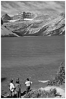 Family standing on the shores of Bow Lake. Banff National Park, Canadian Rockies, Alberta, Canada ( black and white)