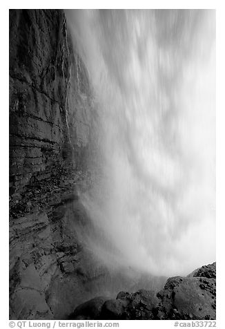 Curtain of water of Panther Falls, seen from behind. Banff National Park, Canadian Rockies, Alberta, Canada (black and white)