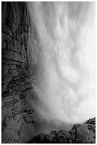 Curtain of water of Panther Falls, seen from behind. Banff National Park, Canadian Rockies, Alberta, Canada ( black and white)