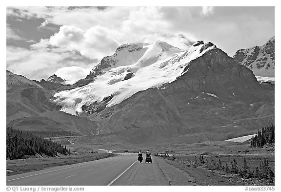 Cyclists on the Icefields Parkway at the base of Mt Athabasca. Jasper National Park, Canadian Rockies, Alberta, Canada (black and white)