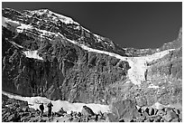 Hikers on a moraine below Mt Edith Cavell, morning. Jasper National Park, Canadian Rockies, Alberta, Canada ( black and white)