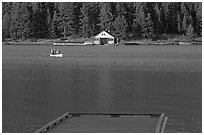 Dock, canoe, and boathouse, Maligne Lake. Jasper National Park, Canadian Rockies, Alberta, Canada (black and white)