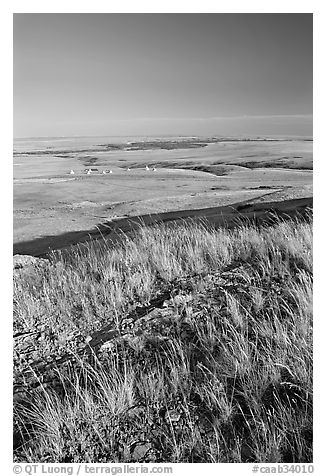 Prairie and teepees from the top of the cliff, Head-Smashed-In Buffalo Jump. Alberta, Canada (black and white)