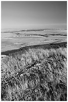 Prairie and teepees from the top of the cliff, Head-Smashed-In Buffalo Jump. Alberta, Canada ( black and white)