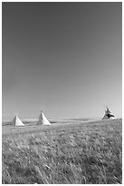 Teepee tents and prairie, late afternoon, Head-Smashed-In Buffalo Jump. Alberta, Canada (black and white)