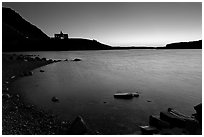 Boulders in Waterton Lake and Prince of Wales hotel, dawn. Waterton Lakes National Park, Alberta, Canada ( black and white)