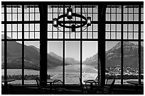 View over Waterton Lake through the windows of Prince of Wales hotel, morning. Waterton Lakes National Park, Alberta, Canada ( black and white)
