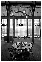 Table in lobby of Prince of Wales hotel with view over Waterton Lake. Waterton Lakes National Park, Alberta, Canada (black and white)