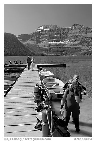 Couple preparing to scuba dive, Cameron Lake. Waterton Lakes National Park, Alberta, Canada (black and white)