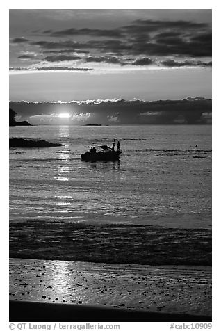 Small boat at Sunset, Half-moon bay. Pacific Rim National Park, Vancouver Island, British Columbia, Canada (black and white)