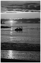 Small boat at Sunset, Half-moon bay. Pacific Rim National Park, Vancouver Island, British Columbia, Canada (black and white)