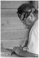 Artist carving a totem pole. Butchart Gardens, Victoria, British Columbia, Canada (black and white)