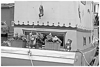 Houseboat decorated with a monkey theme. Victoria, British Columbia, Canada ( black and white)