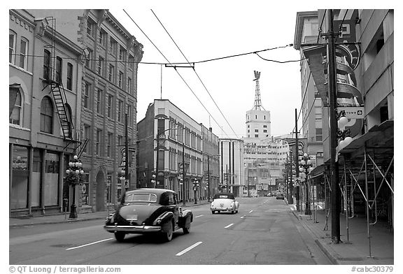 Street in Gastown with two old cars. Vancouver, British Columbia, Canada