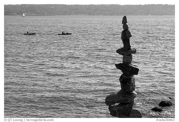 Balanced rocks and kayaks in a distance. Vancouver, British Columbia, Canada (black and white)