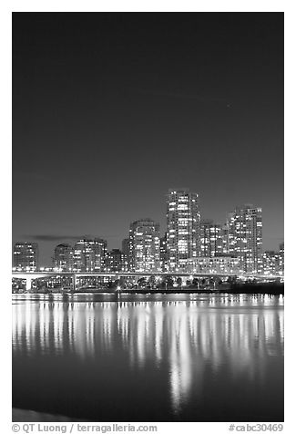 Skyline seen across False Creek at night. Vancouver, British Columbia, Canada (black and white)