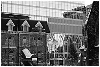 Reflection of an older building in the glass of a modern building, Montreal. Quebec, Canada ( black and white)