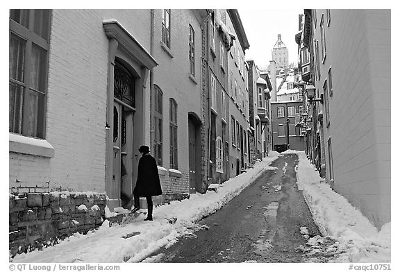 Narrow street partly covered with snow, Quebec City. Quebec, Canada (black and white)