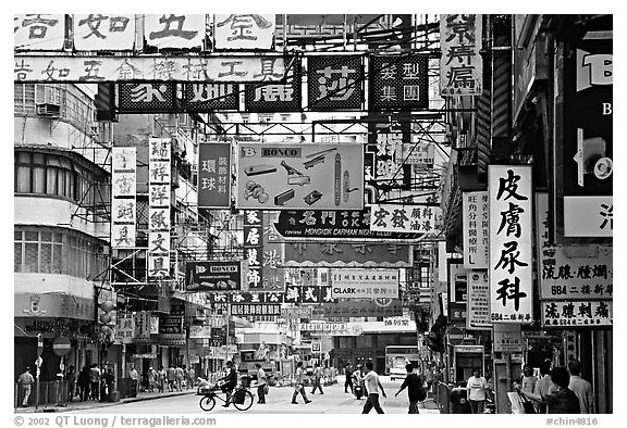 Street in Kowloon with signs in Chinese. Hong-Kong, China