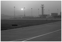 Tarmac and control tower at sunset, Beijing Capital International Airport. Beijing, China (black and white)