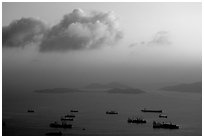 Cargo ships anchored outside of the harbor. Hong-Kong, China (black and white)