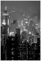 Center building with changing lights from Victoria Peak at night. Hong-Kong, China (black and white)