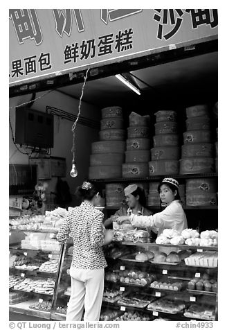 Women at Muslim pastry store. Kunming, Yunnan, China (black and white)
