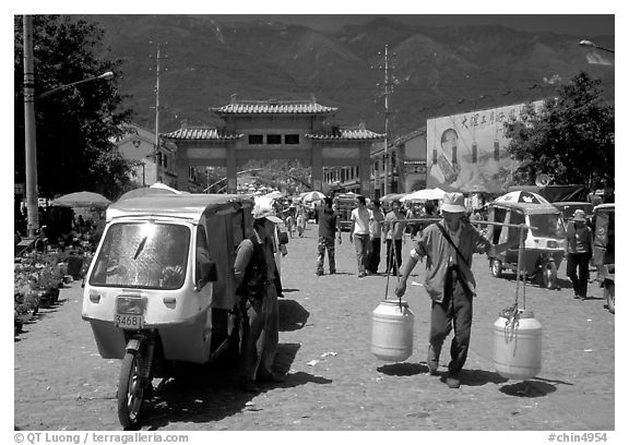 Street activity in front of the West gate. Dali, Yunnan, China (black and white)