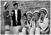 Women wearing traditional Bai dress. Dali, Yunnan, China (black and white)