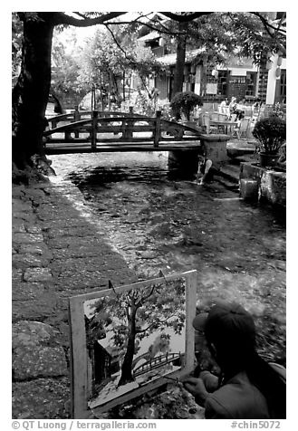 Painting a bridge. Lijiang, Yunnan, China (black and white)