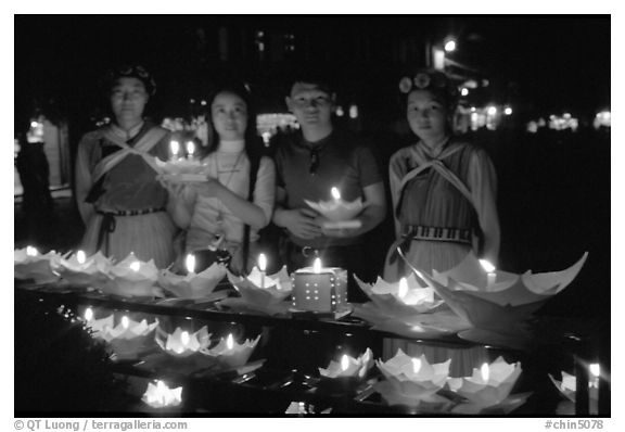 Candlelight lanters to be floated on a canal at night. Lijiang, Yunnan, China (black and white)