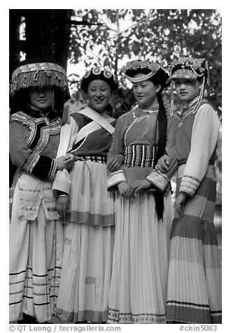 Women wearing Naxi dress. Lijiang, Yunnan, China (black and white)