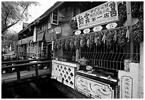 Snack Food in Lijiang restaurant overlooking a canal. Lijiang, Yunnan, China ( black and white)