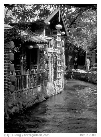 Houses along a canal. Lijiang, Yunnan, China (black and white)