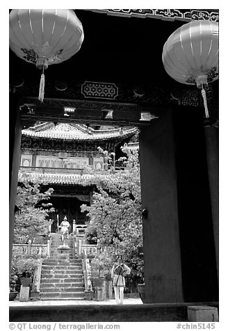 Ming dynasty Wufeng Lou (Five Phoenix Hall), seen through entrance arch. Lijiang, Yunnan, China (black and white)