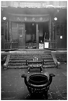 Urn in courtyard inside Xixiangchi temple. Emei Shan, Sichuan, China ( black and white)