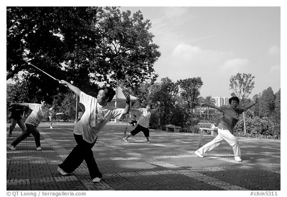 Collective exercise gymnastics with swords,  Liuha Park. Guangzhou, Guangdong, China